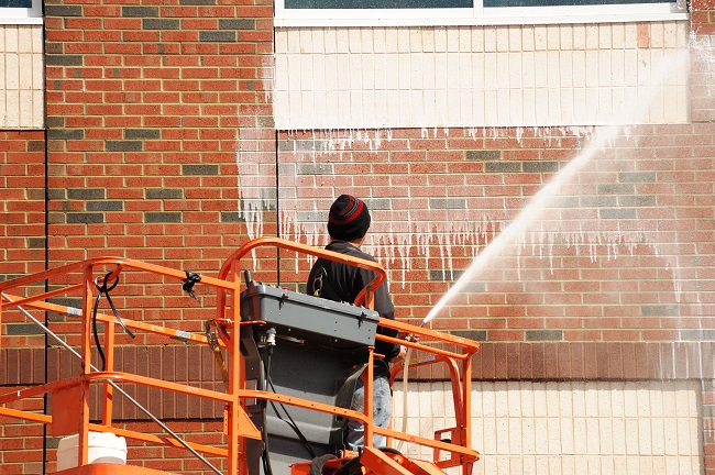 Schedule Pressure Washing to Protect Your Exterior Walls from Organic Growth